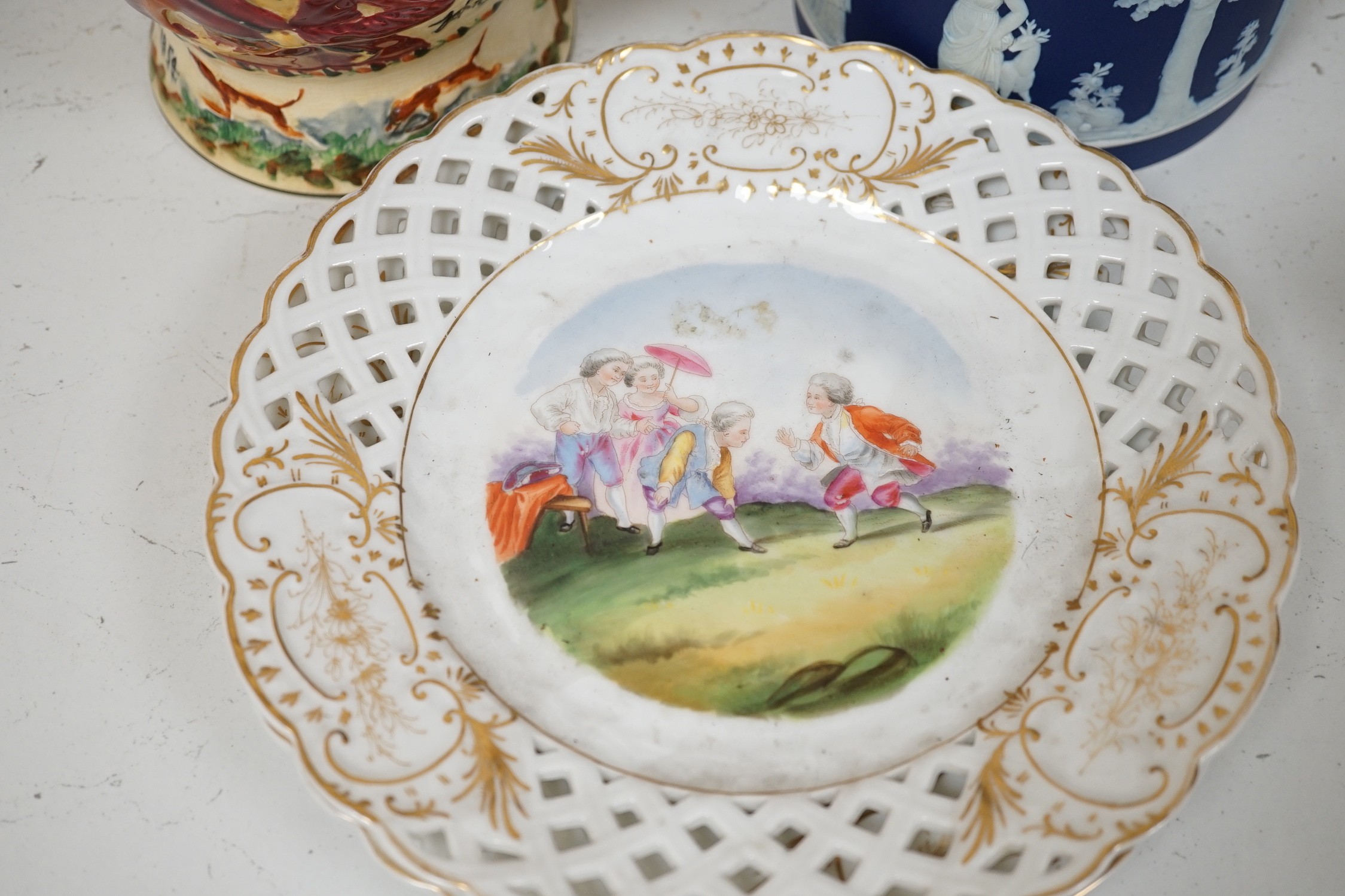 A pair of John Peel musical character jugs, a Wedgwood Jasper Ware biscuit box, enamel green glass basket and a pair of basket figural ceramic plates.